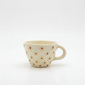 Ceramic mug with floral pattern on a white background