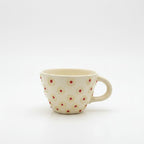 Ceramic mug with floral pattern on a white background