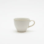 White ceramic mug on a white background